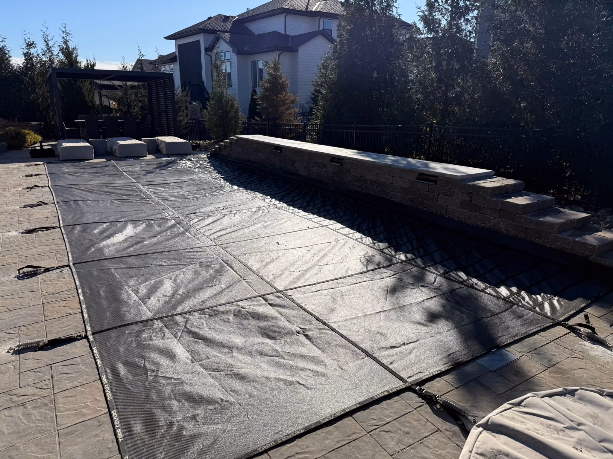 Reflection31 w Pad Overland Park fiberglass pool install seasonal cover 01 — Hometown Pool Kansas