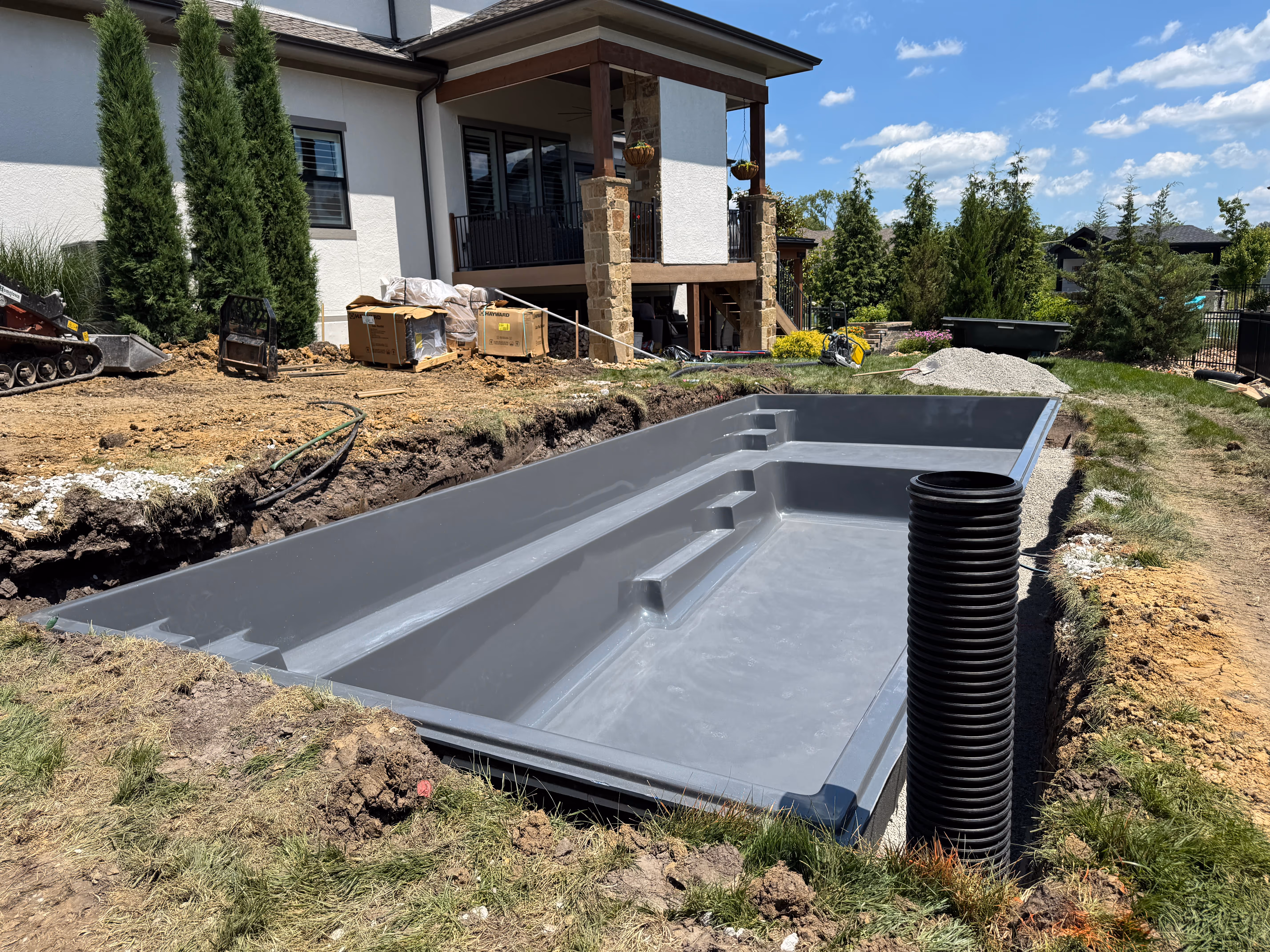 Reflection31 w Pad Overland Park fiberglass pool install shell set 01 — Hometown Pool Kansas
